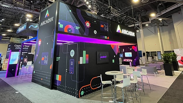 Side view of Arcadia’s HIMSS booth highlighting LED features, digital engagement zones, and high-impact brand presence.