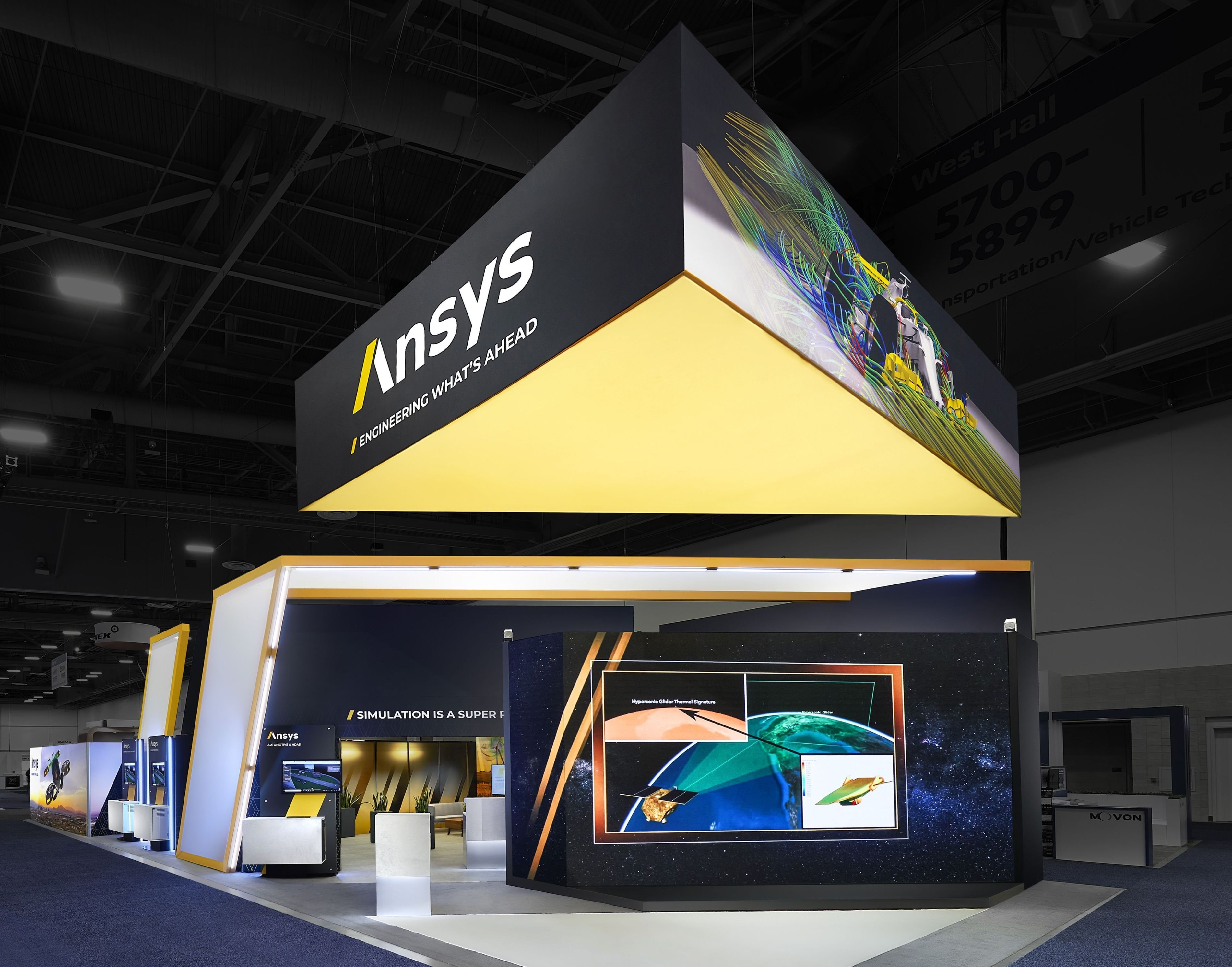 30x80 large-scale tech exhibit design at NPE showcasing technical demonstrations and modern booth architecture