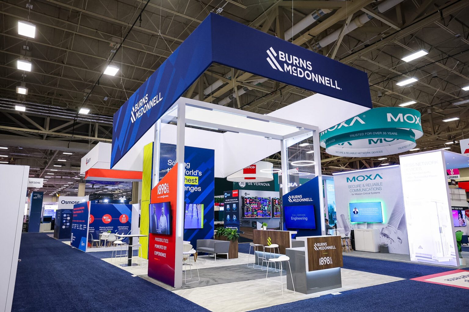 Front view of Burns & McDonnell’s DistribuTECH 2025 exhibit highlighting digital touchpoints and modern architecture