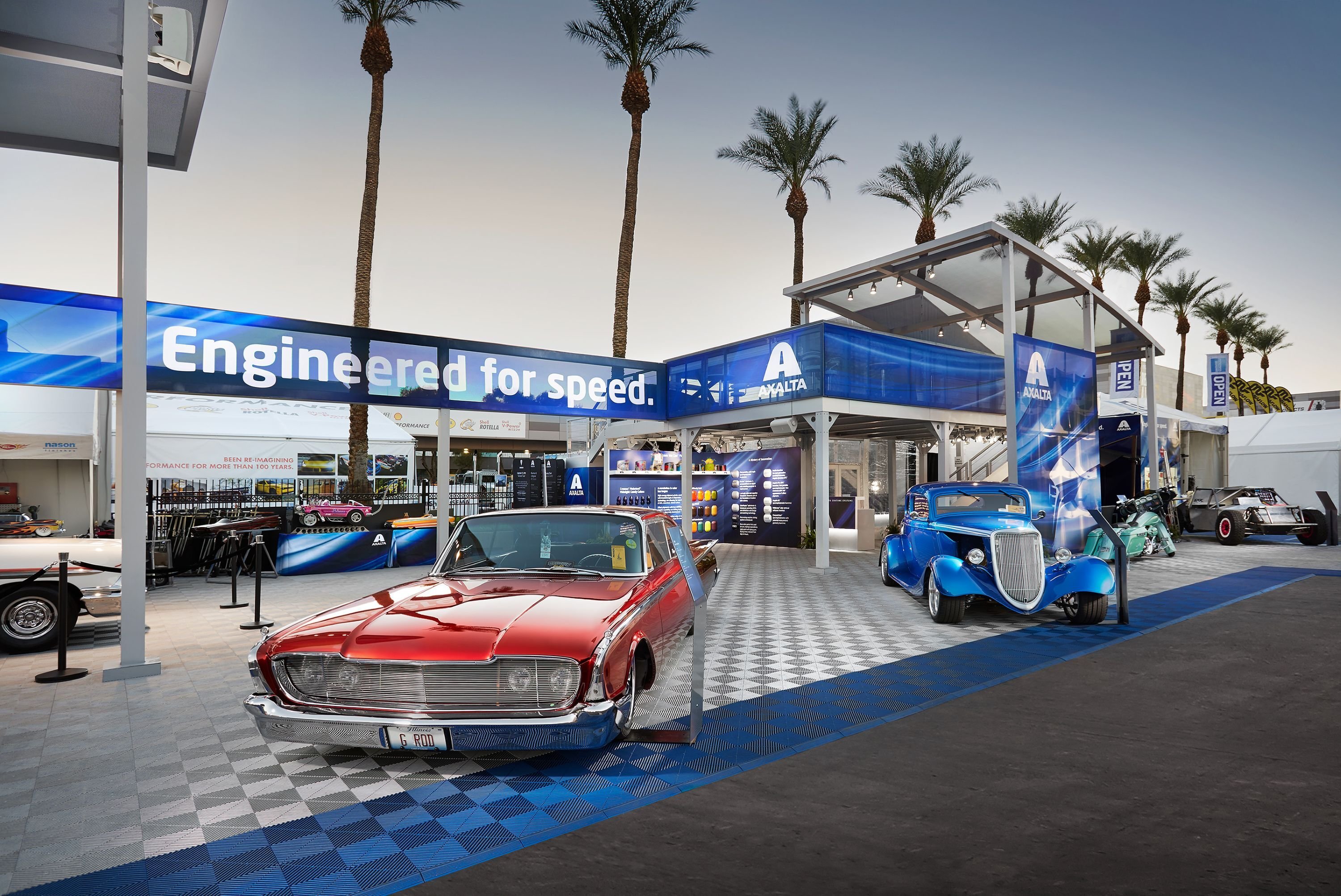 30x50 custom SEMA trade show booth for Axalta featuring automotive & machinery and outdoor branding