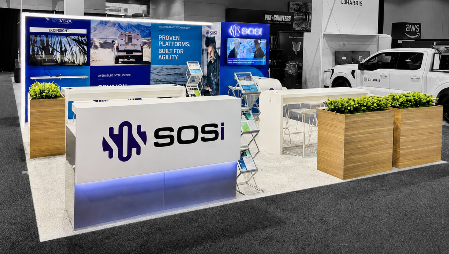 SOSi island trade show exhibit featuring modular architecture, illuminated branding, and flexible exhibit components