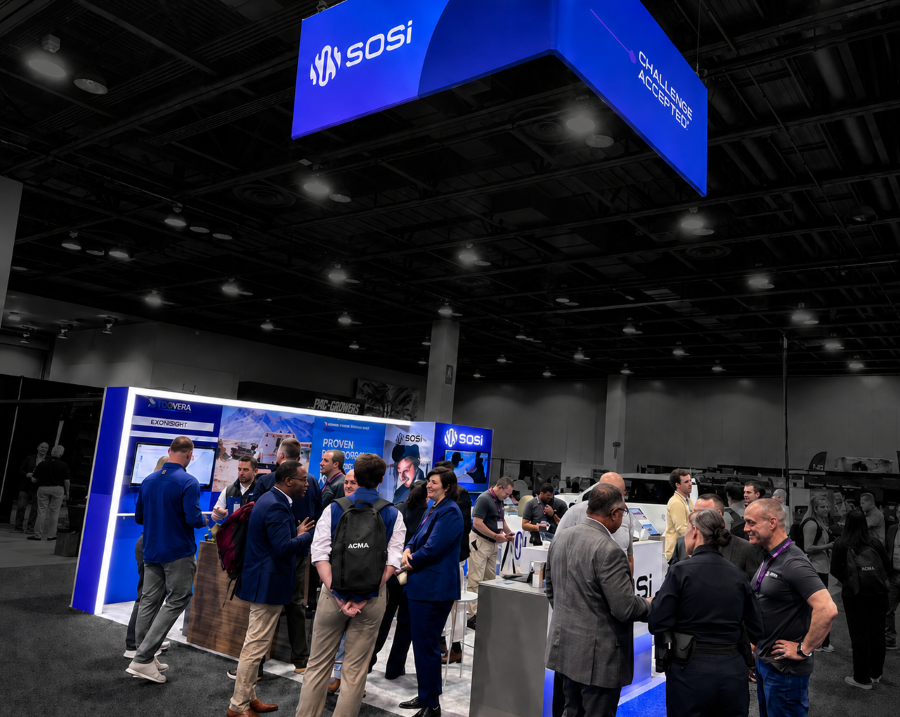 Attendees engaging with SOSi's scalable trade show exhibit during a defense and technology industry event