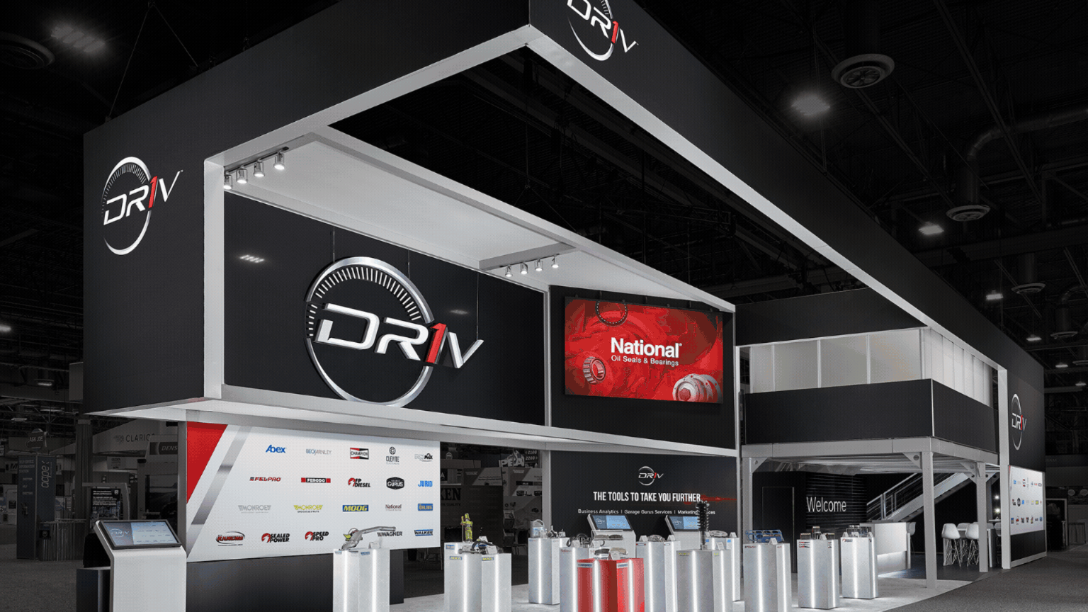 SEMA exhibit builder showcasing custom industrial trade show booths with heavy equipment